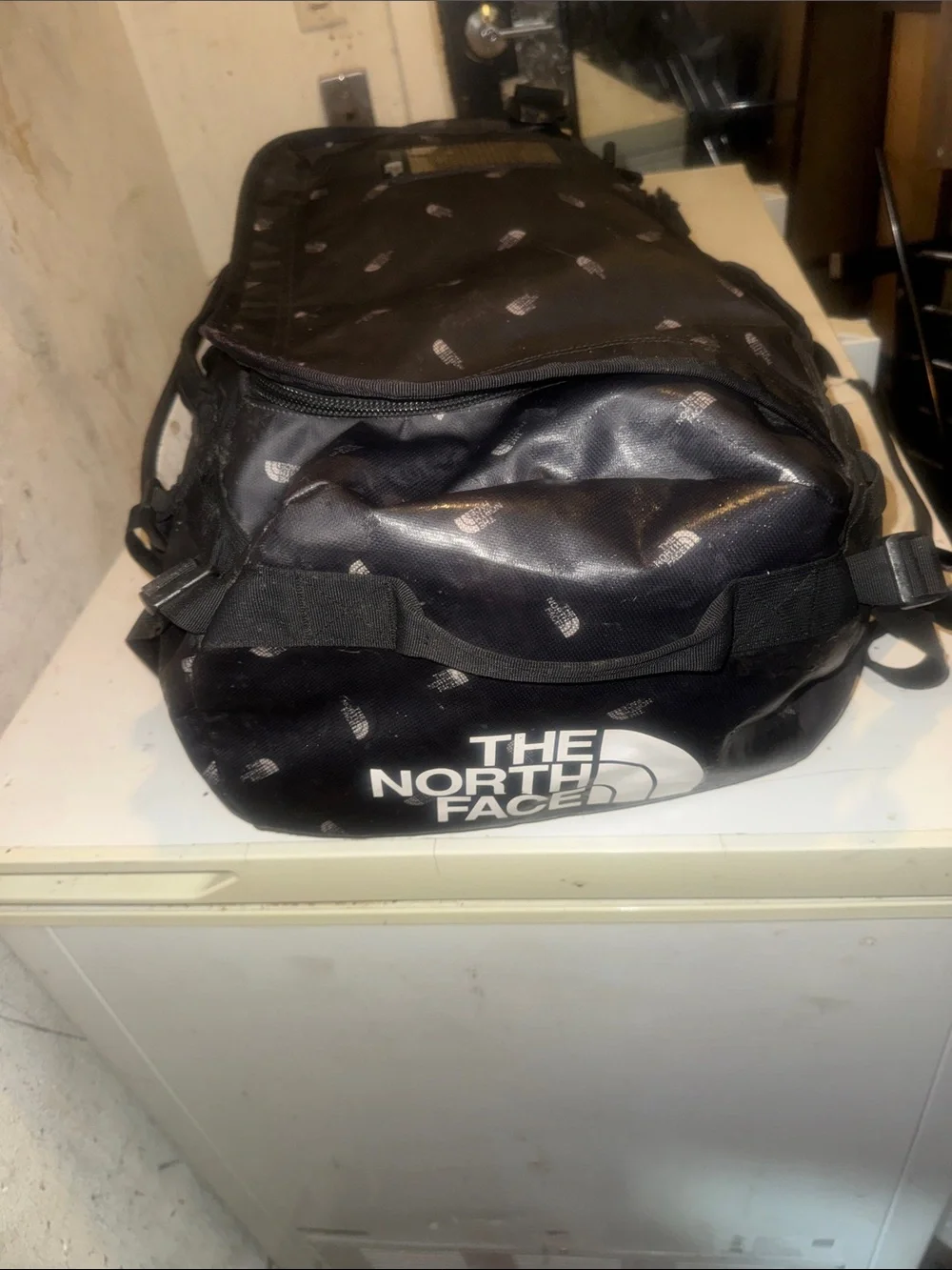 The North Face limited edition Black Duffel Messenger Bag with TNF logo repeat